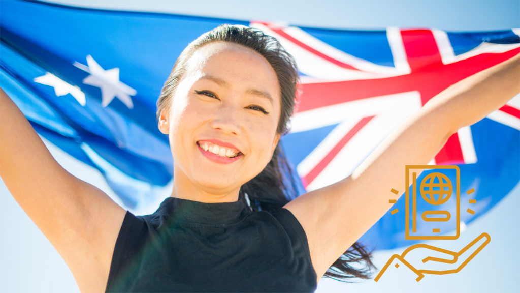 A woman holds an Australian flag aloft.